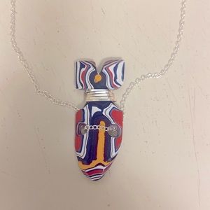 Sterling silver wrapped fordite necklace